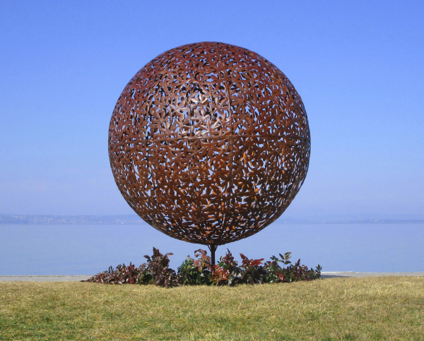 Big garden ball artwork rusty